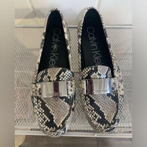 Calvin Klein size ten snakeskin flats in like new condition.